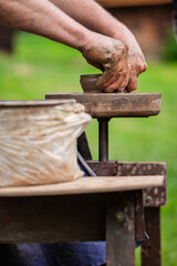 Man making a pot.