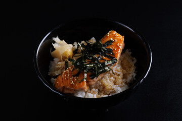 salmon teriyaki suace japanese food isolate in black background