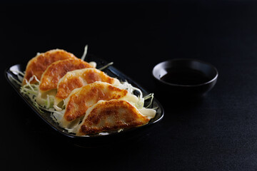 Gyoza Japanese food dumpling isolated in black background