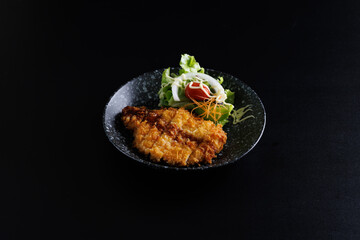 Tonkatsu Traditional Japanese food, Deep Fried Pork Cutlet isolate in black background