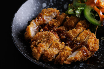Tonkatsu Traditional Japanese food, Deep Fried Pork Cutlet isolate in black background