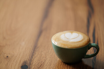 Cup of cappuccino with foam and sprinkled with cinnamon, a delicious coffee for a moment of tranquility and relaxation.