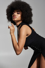 Appealing woman shares a tender embrace, exuding passion and confidence in a chic atmosphere.