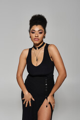 A beautiful woman posing in stylish dress.