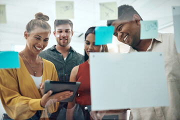 Group, glass wall and teamwork in office with sticky note for idea, tablet or smile for synergy at startup, Team, board and reading with brainstorming, diversity or problem solving at creative agency