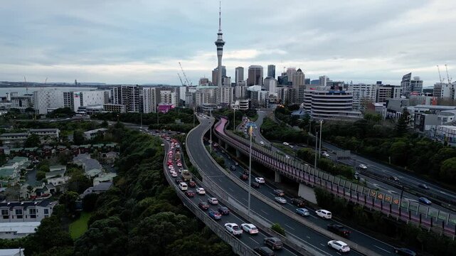 Auckland, New Zealand: Aerial drone footage of the traffic that rush on highway junction in Auckland with downtown district in New Zealand largest city. 