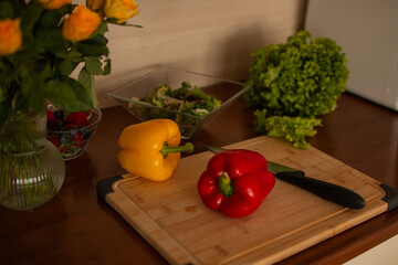 A wooden kitchen counter with fresh vegetables