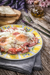Fried eggs with sausage.