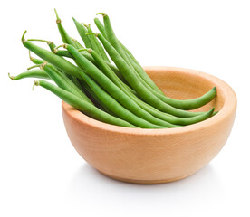 Fresh string green beans in a wooden bowl isolated on white background