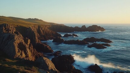 Fototapeta premium Rocky coastline with crashing waves at sunset.