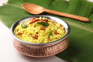  Lemon rice recipe also known as chitrannna or nimmakaya pulihora is a South Indian dish made with rice, tempering spices & curry leaves. Served in a copper bowl with appalam or papad