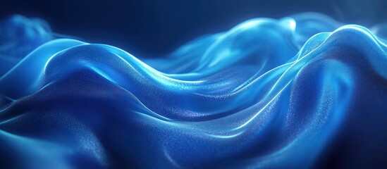 Obraz premium Abstract blue fabric waves with a soft and flowing texture.