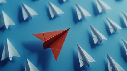 Red paper plane leading among a white planes on blue background. Business competition and Leadership concept