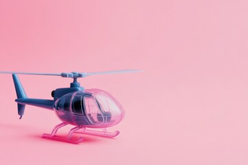 Toy helicopter on a pink backdrop with empty area for text