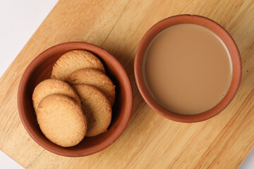 Earthen tea cup or Chai in kulhad, Masala chai is a popular beverage throughout South Asia, originating in India. It is made by brewing black tea in milk and water, and then by sweetening with sugar.