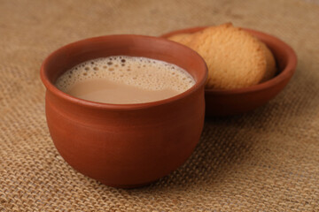 Earthen tea cup or Chai in kulhad, Masala chai is a popular beverage throughout South Asia, originating in India. It is made by brewing black tea in milk and water, and then by sweetening with sugar.