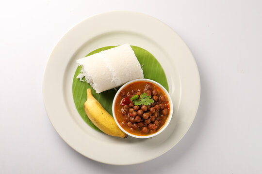 Puttu or Raw rice puttu with chana curry or kadala curry-Kerala special breakfast items made using raw rice flour, an ideal combination with banana