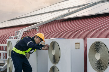Engineers is checking the air conditioning cooling system of a major building or industrial...