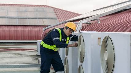 Fototapeta premium Engineers is checking the air conditioning cooling system of a major building or industrial facility.