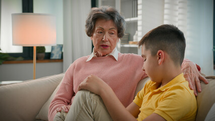 Caucasian family two generations strict serious old woman grandmother pensioner scolding offended...