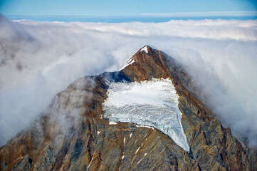 Arial of snowcapped mountain glacier