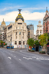 Naklejka premium Neoclassical style buildings in the streets of Alcala and Gran Via in the capital, Madrid, Spain