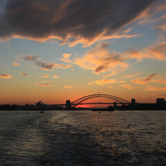 Obraz premium Skyline of Sydney and harbour bridge at sunset, Australia.