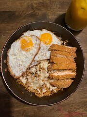 Fried spicy noodles with fried eggs, spicy fried chicken breast, mozzarella cheese and toasted sesame seed. Samyang buldak spicy noodle