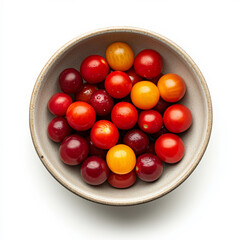 A bowl of cherry tomatoes in various shades of red, isolated on a white background, showcasing a fresh salad ingredient