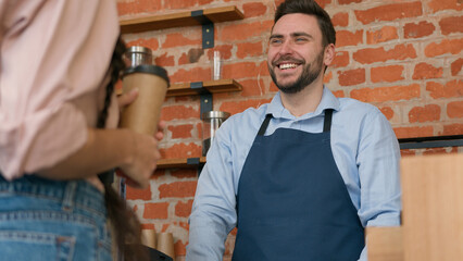 Woman customer pay use contactless payment technology NFC on phone in cafe bar restaurant smiling man waiter barista serving client at counter in cafeteria girl paying through bank mobile app terminal