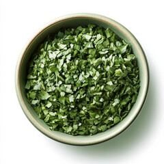 A bowl of chopped cilantro, isolated on a white background, highlighting a fragrant herb