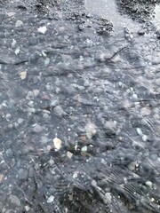 running water over pebbles