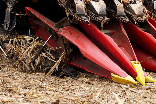 Side view. Red header header of a corn harvester close-up