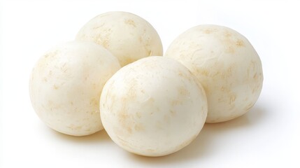 A cluster of four fresh jicama roots rests on a pristine white background, showcasing their pale skin and spherical form, ideal for healthy eating and cooking