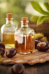 Horse chestnut seed tincture in a glass bottle outdoors