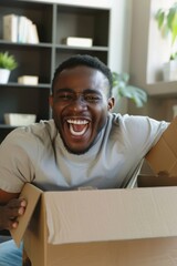 African American male laughing in surprise upon opening package.
