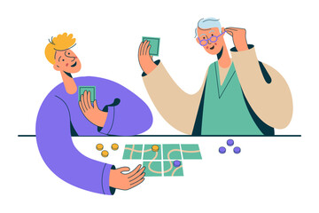 Grandson and grandfather playing boardgames. Older men and boy spending time together,