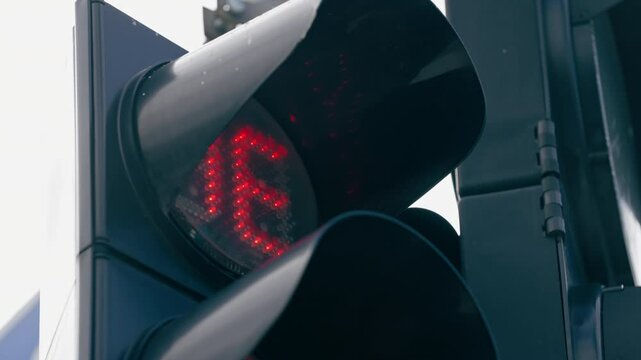 close up city landscape in sky designation signs for movement of cars around the city sign of the crossing zone for people red traffic light timer