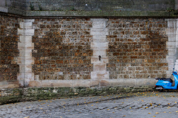 Abstract Old Brick wall Urban Texture with Shabby Damaged and the scooter