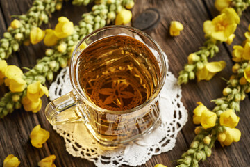 Mullein or Verbascum tea in a glass cup
