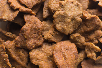 Overhead view of kuli-kuli, close-up view of nigerian groundnut cakes on a plate, fresh homemade nigerian kulikuli