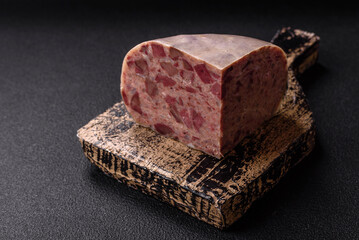 Homemade headcheese with salt, spices, herbs and vegetables