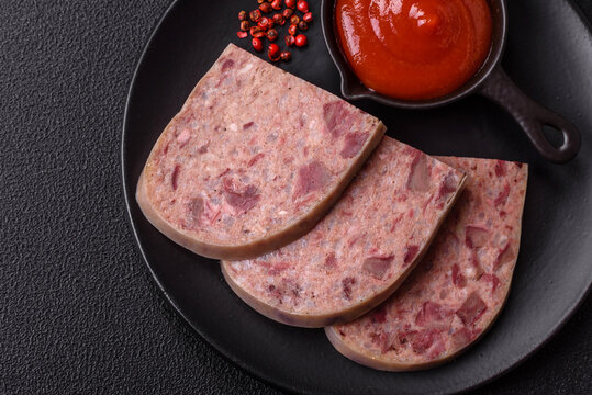 Homemade headcheese with salt, spices, herbs and vegetables