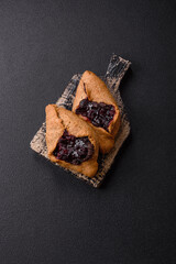 Sweet rye pies with cherries and chocolate