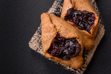 Sweet rye pies with cherries and chocolate