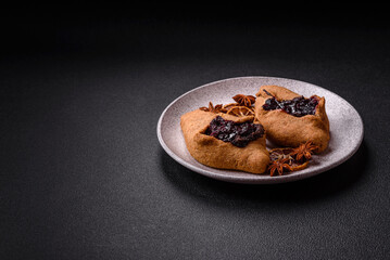 Sweet rye pies with cherries and chocolate