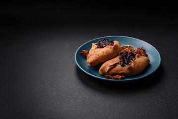Sweet rye pies with cherries and chocolate