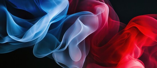 Obraz premium Abstract blue, red, and white smoke swirls on a black background.