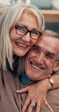 Love, hug and face of mature couple, romance and celebration of commitment in marriage, care and home. Embrace, smile and senior people in house, happy and trust in relationship, relax or living room