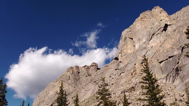 Timelapse of clouds rolling across blue skies above cliffs with bighorn sheep in the Mount Evans Wilderness (Now Mt. Blue Sky Wilderness), Colorado